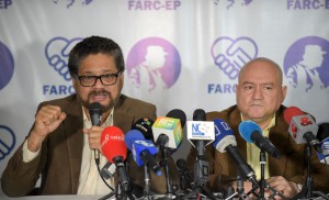 FARC commanders Ivan Marquez (L) and Carlos Lozada deliver a press conference announcing the launching of their political party in Bogota on July 24, 2017. The FARC guerrillas announced Monday they will launch a legal political party on September 1, after signing on November an agreement to overcome an armed conflict that lasted over half a century. / AFP / Raul Arboleda